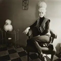 Diane Arbus, Lady Bartender at Home with a Souvenir Dog, New Orleans, LA, 1964, Gelatin silver print on Agfa paper, printed later by Neil Selkirk