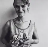 Roger Ballen, Wife of Abattoir Worker holding three Puppies, Orange Free State/South Africa, 1994, Toned gelatin silver print, printed
