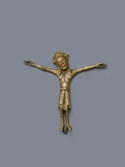 A bronze Corpus Christi, attributed to Germany, 12th century by Probably German 12th century, Cast, engraved, stamped and gilded bronze. Depicting Christ crucified with four nails with arms stretched wide apart and, sold May 2025