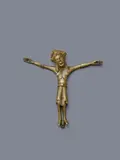 Probably German 12th century, A bronze Corpus Christi, attributed to Germany, 12th century, Cast, engraved, stamped and gilded bronze. Depicting Christ crucified with four nails with arms stretched wide apart and His head leaning to one side. The rib cage and perizonium are depicted with great attention to detail. Small drilled holes in the halo and shoulder. Cracks above the rib cage and on the right wrist. Abrasions throughout