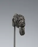 Italy 16th century, A 16th century Italian carved stone head, Carved in the round, patina throughout. This small, fragmentary sculpture of a hand holding aloft a severed head with blood pouring from the neck could be the head of John the Baptist from a depiction of Salome. The underside of the hand drilled to a plexiglass stand