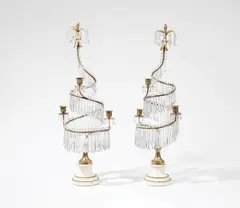 Werner & Mieth, A pair of three-flame bronze candelabra, Fire gilt bronze/brass, glass droplets, white marble. Twisted candle holders hung with faceted glass prisms, with flower bud finials. H c