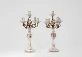 A pair of Berlin KPM bronze-mounted porcelain candelabra by Königliche Porzellanmanufaktur Berlin Kpm, Porcelain, coloured overglaze decoration, gilding, fire-gilded bronze. Model no. 3157, fired in several parts and screw-, sold Apr 2024