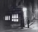 Commissariat de Police, Rue de la Huchette, Paris by Christian Bérard, 1933, Ferrotyped gelatin silver print, printed 1960s, sold Dec 2023