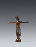 Limoges c. 1200, A Limoges enamelled bronze Corpus Christi, around 1200, Cast and engraved bronze with old patina and minimal remains of enamel. Depicting the crowned figure of Christ crucified with four nails, with His arms horizontally outstretched. Minimal dents with losses to the crown