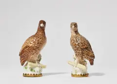 Königliche Porzellanmanufaktur Berlin Kpm, A rare pair of Berlin KPM porcelain quails, Model no. 163. Naturalistically painted birds on rock perches, each holding a sheaf of wheat in its claw. With gilt bronze mountings. A tiny chip to one beak, restorations to the wheat and the upper part of the head of the second bird. H 16.8 and