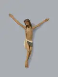 Spain around 1420 & 1430, A carved wood Corpus Christi, Spain, around 1420/1430, Presumably walnut, carved in the round, the reverse slightly flattened. The arms separately attached. The polychromy presumably original, slightly retouched in areas. A figure of Christ on the Cross designed for a lowered viewpoint. He is depicted with arms outstretched and slightly raised and with His feet crossed in the "three nail" crucifixion type. His head, adorned with the Crown of Thorns, is leant to one side in death and His mouth slightly opened. His body is depicted with elongated proportions, dressed in a perizonium, and rendered realistically but in a reduced fashion that only serves to heighten the expressive quality of the work. The piece can be compared to Spanish painting and sculpture of the first half of the 15th century. With vertical hairline cracks and minor wear throughout