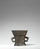 Hendrick Wegewart, jr., A Dutch mortar from 1609, Golden brown cast bronze with chocolate brown patina. Decorated with one thinner and one thicker band of arabesques with acanthus leaves and delicate tendrils. The upper section with a broad banderole inscribed in Latin capital letters: “LOF GODT VAN AL Ao 1609”. The handles formed as dolphins. H 13.1, D