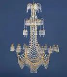 Werner & Mieth, An opulent chandelier in the form of a Chinese pagoda, Gilt bronze/brass, cut glass. With twelve branches issuing from six arcs forming the lower hoop. Six further lanterns issuing from the crystal canopy above, surmounted by six palm branches hung with crystals. The tapering shaft densely draped with crystal adorned horizontal chains. H c. 130, D c