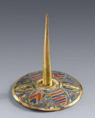 A cast bronze travel candlestick by Limoges first half 13th century, Cast bronze with engraved, gilded and enamelled decoration. The round, slightly domed base of the candlestick emblazoned, sold Jul 2021