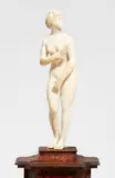 circle of Leonhard Kern, A carved ivory figure of the Venus Medici, Ivory, carved in the round. Ivory statuette depicting a nude figure of Venus standing in contrapposto with her head raised and facing to one side and her hands held before herself to cover her nudity. The work closely follows the composition of the Hellenistic marble “Venus Medici” from the 3rd century BC that is housed in the Uffizi in Florence. In the 17th century, the figure was widely disseminated in the form of drawings and prints throughout the whole of Europe, for example in a drawing by Pieter van Lint (1609-1690) made in 1640 now in The Metropolitan Museum of Art in New York (inv. no. 64.197.8). This finely carved sculpture was most likely produced in Germany in the 17th century, and is generally attributed to the circle of Leonhard Kern. With vertical hairline cracks and yellowing. Mounted on a wooden plinth with metal pins