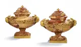 Pierre Gouthière, A pair of 'navettes couvertes' vases, Breche d'Alep marble vessel of oval section carved from three pieces of stone making up the base, body with moulded shoulders and the lid. With ormolu appliqués: A jagged polished band around the shoulders entwined by a matte oak leaf garland, heads of Daphne on both of the narrow sides with branches as the hair, and chain borders around the base and lid. Mounted on a rectangular ormolu base. H ca. 30, W ca. 32, D ca