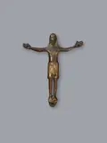 Maasland, A bronze Corpus Christi, presumably Maasland, first half 13th century, Engraved cast bronze with minimal remains of former gilding. A depiction of Christ with His head upright, His arms spread horizontally to the sides, His legs parallel and His feet resting on a subpedaneum. The figure's nudity is concealed by a perizonium knotted in the centre. Abrasions. Mounted on a velvet covered panel