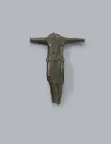 Maasland, A bronze Corpus Christi, presumably Maasland, first half 13th century, The reverse hollowed out, engraved bronze with older patina. Depiction of Christ crucified with three nails and His arms stretched out horizontally. Despite the fragmentary condition of the piece, its fine quality is still evident to this day, especially in the detailed rendering of the perizonium and the engraving. Head, hands, and feet missing. Abrasions throughout