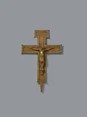 German 2nd half 12th century, A German bronze processional cross, probably second half 12th century, Engraved gilded bronze. The cross beams, the lowest of which has a pricket on its underside, are each decorated with borders of identical stylised rosettes. The crowned Corpus Christi is shown crucified with four nails, His feet resting on a subpedaneum. The perizonium is carefully rendered and of noticeably angular design. The work is almost certainly German in origin and it has been suggested that it may have been made in Saxony. A small breakage to the neck of Christ. Minimal wear, two of the finials at the angles lost