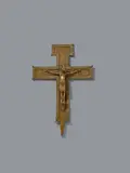 German 2nd half 12th century, A German bronze processional cross, probably second half 12th century, Engraved gilded bronze. The cross beams, the lowest of which has a pricket on its underside, are each decorated with borders of identical stylised rosettes. The crowned Corpus Christi is shown crucified with four nails, His feet resting on a subpedaneum. The perizonium is carefully rendered and of noticeably angular design. The work is almost certainly German in origin and it has been suggested that it may have been made in Saxony. A small breakage to the neck of Christ. Minimal wear, two of the finials at the angles lost