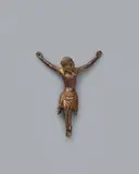 Rhineland Circa 1300, A Rhenish bronze Corpus Christi, circa 1300, The reverse hollow cast, engraved bronze with remnants of gilding. A depiction of the crucified Christ with raised arms, feet crossed beneath a single nail, and head leaning slightly to one side. The sculptural quality of the bronze is evident throughout in the depiction of the figure's flesh and the drapery of the perizonium, but especially in the rendering of the facial features and the finely chased details of the hair. Drilled holes to the hands and feet. Minor abrasions