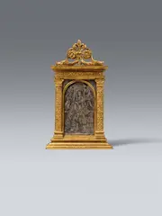 Italy Late 15th century, A late 15th century Italian pax with the Virgin enthroned, Silver, silver niello and gilt bronze. This pax has a handle on the reverse and a richly ornamented architectural surround made up of Renaissance motifs terminating in a fish-headed scroll design in the upper section. The exceedingly finely wrought niello, which is accompanied by the inscription “MARIA GRATIA PLENA“ depicts the Virgin enthroned surrounded by adoring angels making music and four kneeling saints. This panel is thought to originate from Florence. Minimal wear with very minor losses to the niello
