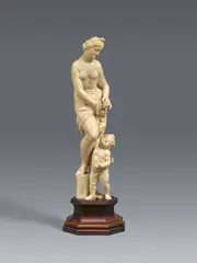 attributed to Adam Lenckhardt, A carved ivory Venus and Cupid group attributed to Adam Lenckhardt, Carved in the round and partially freestanding. A figure of Venus shown standing and dressed only in a perizonium, placing her extended right foot upon a boulder. At her feet, the little Cupid is depicted handing her an apple. This small and finely carved sculpture is traditionally attributed to Adam Lenckhardt, one of the most important representatives of Baroque ivory carving. Following an apprenticeship under his father Nikolaus Lenckhardt, Adam Lenckhardt travelled throughout Italy before settling in Vienna in 1638, where he advanced to become the chamber sculptor of Prince Karl Eusebius of Liechtenstein from 1642 to 1660. The wing, formerly attached with a dowel, lost as well as the bow that Cupid would have originally held in his left hand. Some discolouration. Mounted on a modern wooden plinth