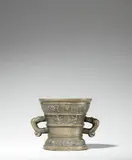 A Hachmann mortar made for Johan die Ruey by A Hachmann mortar made for Johan die Ruey, Golden brown cast bronze with natural patina. The display side decorated with a vacant coat-of-arms supported by winged , sold Jun 2021