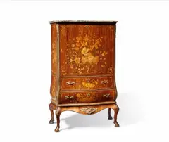 A highly important writing desk by Abraham Roentgen, A highly important writing desk by Abraham Roentgen, Red satinwood, rosewood, kingwood, and snakewood, burr walnut, marquetry in holly, hornbeam, stained and scorch-shaded maple on oak corpus, the apron of carved cherry. Brass and ormolu mountings, iron locks, replaced green waxed cloth writing surface with embossed border, "brocatello di Siena" marble. "Secrétaire à abattant" in two parts. Comprising chest of drawers with fall front desk above a stand with zoomorphic carved supports beneath a concave apron with vertical marquetry décor. The upper corpus with a bombé form lower section with two drawers and upper section with a central compartment flanked by two rows of five drawers and two upper drawers. The central compartment surrounded by a double-arched architectural border and with a pull-down blind with zigzag veneered slats concealing seven drawers above a lower compartment. All drawer fronts with lively burr patterned veneer and pronounced borders. The upper corpus with vertically grained veneer, also over the transverse areas and fluting. All three faces decorated with finely detailed floral marquetry framed by filets with rocaille motifs in the centres and corners. The underside of the corpus with a label bearing the stencilled initial “K”. The handles of the large drawers and one bronze mounting to the interior replaced. The key later. Marble restored. Some very minor and unobtrusive shrinkage cracks. H 143.5, W 88, D ca