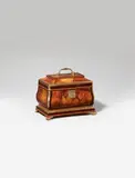 A bombé form box by Abraham Roentgen, A bombé form box by Abraham Roentgen, Burr walnut, kingwood and cherry veneer on solid oak and cherry with fire-gilt bronze, brass and steel mounts. Of rectangular shape with hinged top and handle. The larger base resting on four curved bracket feet. A finely engraved cartouche-shaped lock plate opens by pushing a button which activates a spring mechanism to reveal the keyhole. The box contains a shallow removable tray with two cherry-veneered compartments (which show a horizontal crack) above a large compartment and a shallow secret compartment in the right side of the base which can be opened by pushing a button placed in the inner right side. The exterior is veneered in sheets of large-grained veneers framed by strips of brass and dark palisander stringing. The edges and base highlighted by brass mounts. H 18.5, W 23.3, D