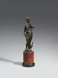 Italy around 1600, An Italian bronze figure of Juno, around 1600, Chased bronze figure cast in the round and with old patina.. A standing figure of the ancient Roman goddess designed to be viewed in the round. She stands in contrapposto clothed in a drapery with her attribute, the peacock, beside her. A casting fault on the back of the right forearm. A breakage to the left foot. A breakage to the reverse between the thighs. Mounted on a round marble plinth