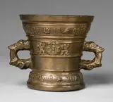A Hachmann mortar made for Vlent Hammans, A Hachmann mortar made for Vlent Hammans, Golden brown cast bronze with natural patina. The display side decorated with winged demi-figures supporting a vacant shield, the reverse with two putti holding a depiction of the veil of Veronica in a round medallion. Two broad bands below the rim and to the rounded base inscribed: "vlent hammans myn hape steit in godt" and "int jaer ons heren m vc lxx". H 14.8, D