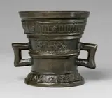 A Hachmann mortar made for Hanrich Claberts by A Hachmann mortar made for Hanrich Claberts, Cast bronze with chocolate brown patina. Both sides decorated with shields bearing house marks supported by winged demi-, sold May 2020