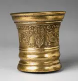 A large and magnificent Grassmayr mortar dated 1681, A large and magnificent Grassmayr mortar dated 1681, Golden brown cast bronze with polished natural patina. The centre of the display side decorated with sage leaves, vases of flowers and angels surrounding a depiction of the crucifixion above a winged putto head and the date “1681”. Inscribed above in capital letters: “F C V S M H V S C C V H P". The base slightly rounded due to usage. H 20.5, D