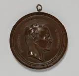 Bernhard Afinger, A cast iron plaque with a portrait of Alexander von Humboldt, Round, bronze patinated plaque in a moulded surround. The lower section chased "B. AFINGER 1854", the reverse engraved "Eigenthum Lauchhammer". D