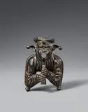 Netherlands second half 15th century, A Netherlandish cast bronze figure of a court jester, second half 15th century, Engraved bronze figure with old patina, hollow reverse. A figure of a man in a fool's cap resting his chin on a flute. The figure's open mouth indicates that it may have originally formed part of a fountain, functioning as a water spout. A very similar counterpiece entered the collection of the Antikenkabinett in Vienna in 1880. That piece was already documented in Ambras in 1596 and is now housed in the Kunsthistorisches Museum in Vienna (op. cit.). Wear to the patin. A soldered repair to the centre of the reverse. Minor wear