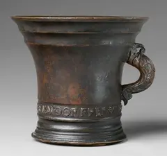 An important signed Enndorfer mortar, An important signed Enndorfer mortar, Golden brown cast bronze with reddish brown patina. Conical form with moulded base and rim. Signed in a broad banderole to the lower section "ALLEX ENNDORFFER GOS MICH". Dated in relief "1535" beneath the broad rim. Dolphin handles. H 21.8, D