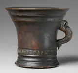 An important signed Enndorfer mortar, An important signed Enndorfer mortar, Golden brown cast bronze with reddish brown patina. Conical form with moulded base and rim. Signed in a broad banderole to the lower section "ALLEX ENNDORFFER GOS MICH". Dated in relief "1535" beneath the broad rim. Dolphin handles. H 21.8, D