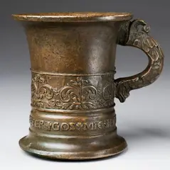 An important signed Enndorfer moratar, An important signed Enndorfer moratar, Cast bronze with slightly mottled brown patina. Tall cylindrical form with flaring rim. Cast with a band of stylised flowerhead motifs above the signature "LVDWIG ENNDORFFER GOS MIC 15 42". One dolphin handle. H 15.3, D