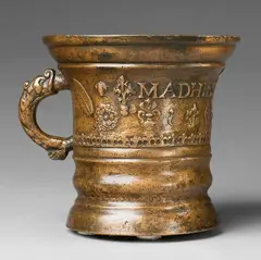 Werkstatt Grassmayr, A dated and inscribed Grassmayr mortar, Golden brown cast bronze with slightly mottled golden bronze patina. Cast with a series of motifs to the centre: Mascarons, flowerheads, naturalistic sage leaves, and angel and cherub mascarons. Dated "1665" below the inscription "MADHIES PRVNER". With horizontal cracks. H 17.2, D