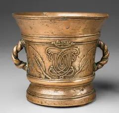 Werkstatt Grassmayr, A dated Grassmayr mortar with a conjoined monogram, Golden brown cast bronze with fine golden brown patina. With fine relief decor to either side: A laurel wreathed shield above the date "1686" engraved into the base. To the reverse the crowned conjoined monogram "CvL". Both motifs flanked by two casts of sage leaves. Laurel sprigs cast beneath the scrolling C-shaped handles. Signs of an earlier mounting in the cavity above the base. H 15.5, D