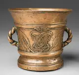 Werkstatt Grassmayr, A dated Grassmayr mortar with a conjoined monogram, Golden brown cast bronze with fine golden brown patina. With fine relief decor to either side: A laurel wreathed shield above the date "1686" engraved into the base. To the reverse the crowned conjoined monogram "CvL". Both motifs flanked by two casts of sage leaves. Laurel sprigs cast beneath the scrolling C-shaped handles. Signs of an earlier mounting in the cavity above the base. H 15.5, D