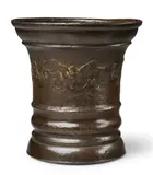 Werkstatt Grassmayr, A dated Grassmayr mortar with a winged putto's head, Cast bronze with slightly mottled chocolate brown patina. With a winged putto's head flanked by sage leaves to the display side, dated "1678" above the initials "LM". One dolphin handle. H 14.2, D