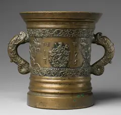 Foundry Reinhard, A large Tyrolese mortar with dolphin handles, Golden brown cast bronze with traces of silver plating and slightly mottled patina. Cast with two bands of rocaille ornament and a heraldic shield to the display side, monogrammed "IAW" and dated "1775", flanked by insects and naturalistic leaf motifs. With acanthus clasped dolphin handles. A horizontal crack to the lower section. H 28.5, D