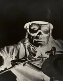 Wolf Strache, Dirt-Track-Fahrer, 1937, Ferrotyped gelatin silver print on Agfa paper, printed probably 1960s (positive/negative inversion)