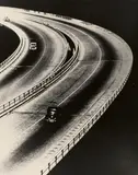 Wolf Strache, Autobahn-Kurve, 1950, Ferrotyped gelatin silver print on Agfa paper, printed probably 1960s (positive/negative inversion)