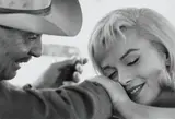 Cornell Capa, Marilyn Monroe and Clark Gable during the filming of 'The Misfits', Nevada