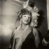 Transvestite at a Drag Ball, New York City by Diane Arbus, 1970, Posthumous gelatin silver print on Agfa paper, printed 1972 by Neil Selkirk, sold Nov 2018