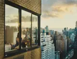 Gail Albert Halaban, Upper East Side, Manhattan, 1438 3rd Avenue, Baby at the Window, 2008, Digital pigment print