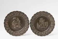 Bertel Thorvaldsen, A pair of cast iron plates with seasonal allegories, With remains of bronze patination, hanging loop attached with plaster and leather to the reverse. With allegorical depictions of Summer and Winter. Unmarked. D