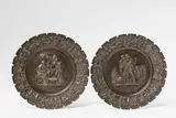 Bertel Thorvaldsen, A pair of cast iron plates with seasonal allegories, With remains of bronze patination, hanging loop attached with plaster and leather to the reverse. With allegorical depictions of Summer and Winter. Unmarked. D