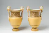 A pair of Berlin KPM Attic style scroll-handled vases by Königliche Porzellanmanufaktur Berlin Kpm, Unidentified model. Fired in two parts and screw mounted. The raised handles issuing from palmettes, the scroll terminal, sold Apr 2018