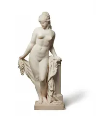 Reinhold Begas, A Carrara marble figure of Phryne, Carved in the round and partially freestanding. Signed "Reinhold Begas" to the back of the plinth. Following his apprenticeship under Ludwig Wilhelm Wichmann, he became an employee and pupil of Christian Daniel Rauch at the Berlin Academy from 1846-1851. After achieving his first success in Berlin, he then travelled to Rome and remained there from 1856-1858. Apart from a few periods in Weimar, Rome, and Paris, Begas was mainly active in Berlin from 1870 until his death in 1911. The present large and finely carved marble sculpture is traditionally thought to be a depiction of the Greek Hetaira Phryne, who was known for outstanding beauty. The catalogue of Begas' estate sale from 1912 (op. cit.) describes this piece as a late work. It appears to have remained in the artist's possession since it was made. The work was apparently based on a small plaster statuette made by the artist in 1864 that was reproduced as a small bronze cast in around 1885. Two very minimal dents to the plinth, otherwise in pristine condition. H