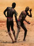 Leni Riefenstahl, Messerkämpfer (from the series: Nuba)